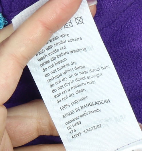 Brand and care label for Mountain Warehouse girls’ purple fleece hoodie, size 14