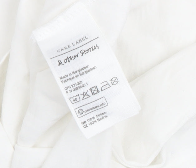 Brand and care label for & Other Stories girls’ white t-shirt, size 12, classic style