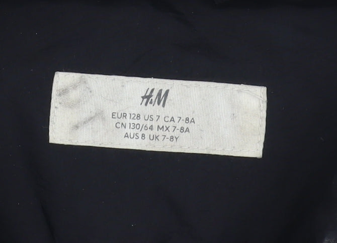 Brand and care label for H&M boys’ black puffer jacket 7-8y long winter coat