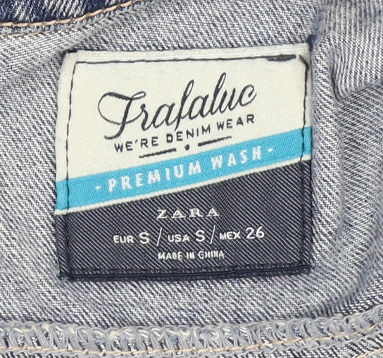 Close-up detail of Zara girls’ blue denim jacket, size S, ripped casual