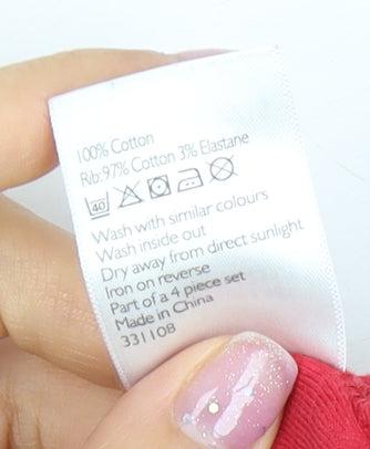Brand and care label for John Lewis girls’ red dog print long sleeve t-shirt