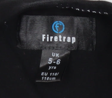 Brand and care label for Firetrap girls’ black graphic skull t-shirt 5-6 years
