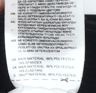 Brand and care label for Adidas girls’ black compression leggings 5-6y athletic fit