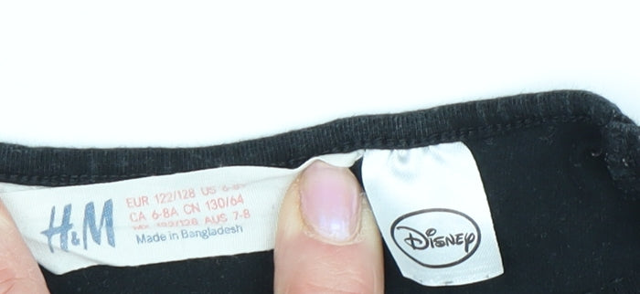 Close-up detail of H&M girls’ black minnie mouse long sleeve t-shirt, size 7-8