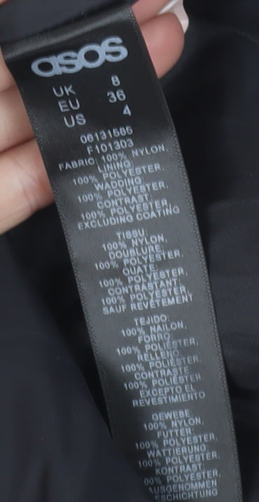Brand and care label for ASOS Women's Black Puffer Jacket, size 8, Winter Style