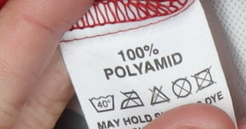 Brand and care label for Newline Men's Red Windbreaker Jacket L