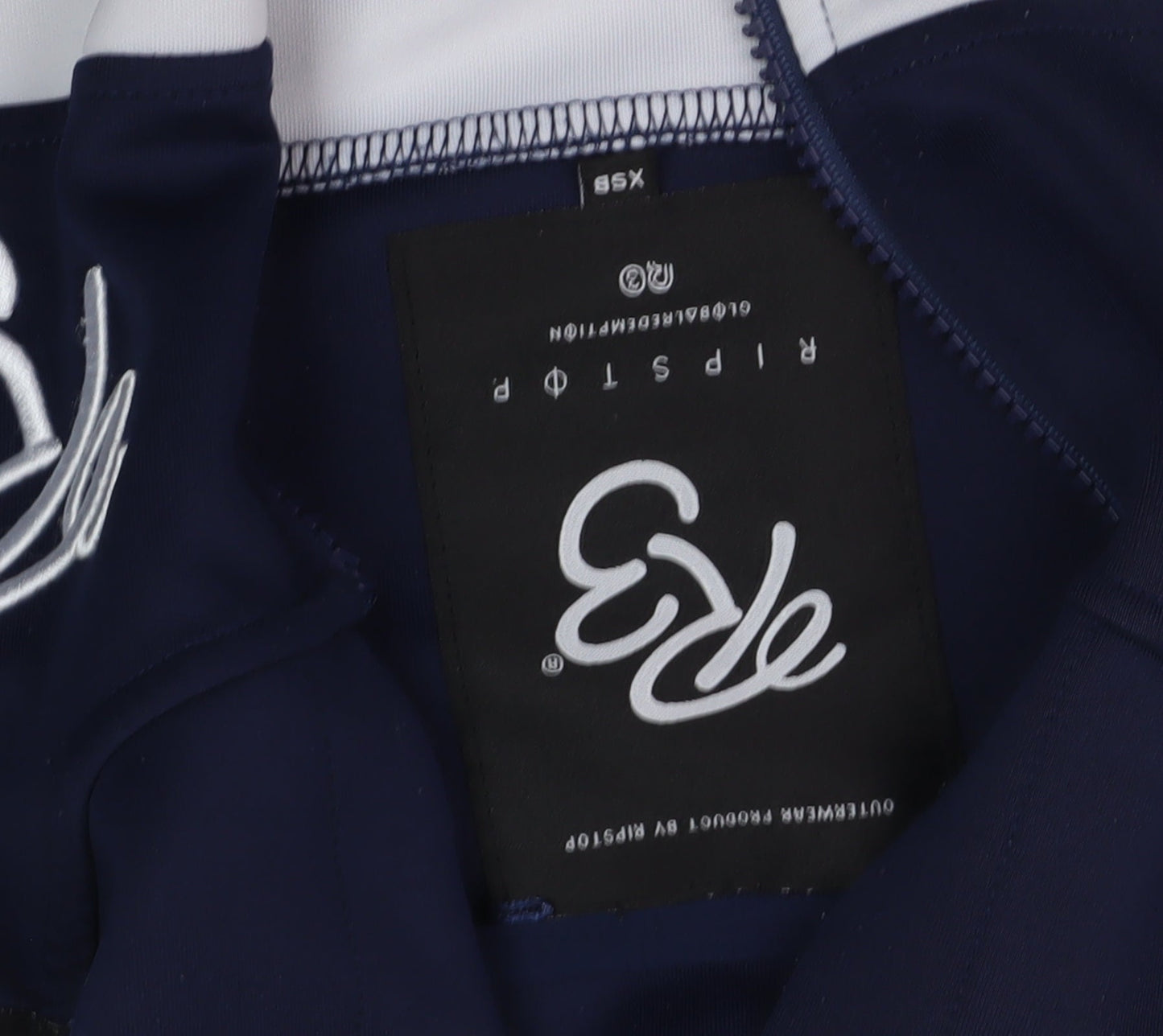Close-up detail of Evo boys’ blue full zip hoodie 2xs with logo accents