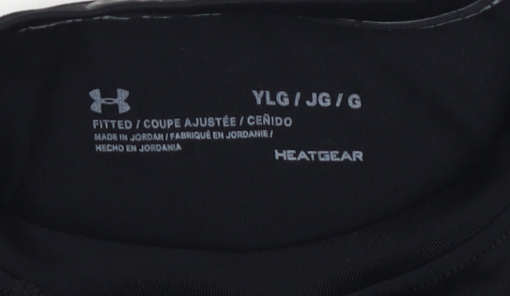 Close-up detail of Under Armour boys’ black long sleeve athletic top