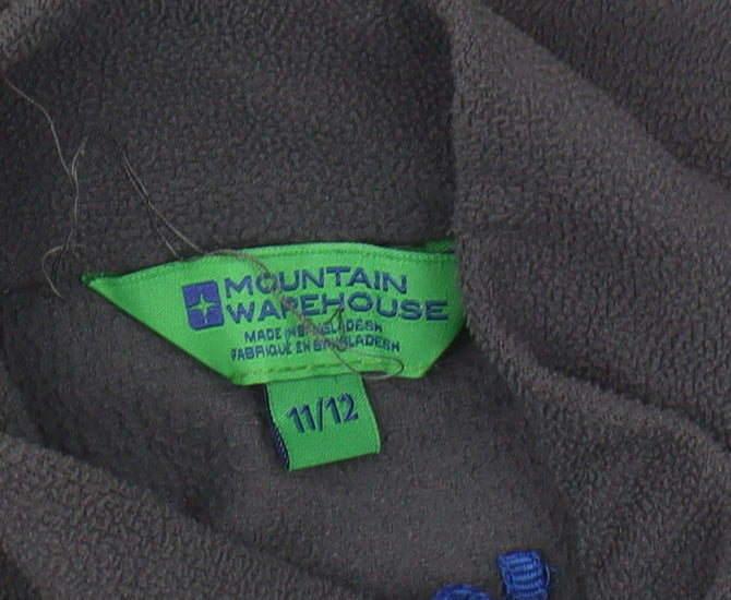 Brand and care label for Mountain Warehouse boys’ grey fleece sweatshirt, size 11-12, 1/2 zip