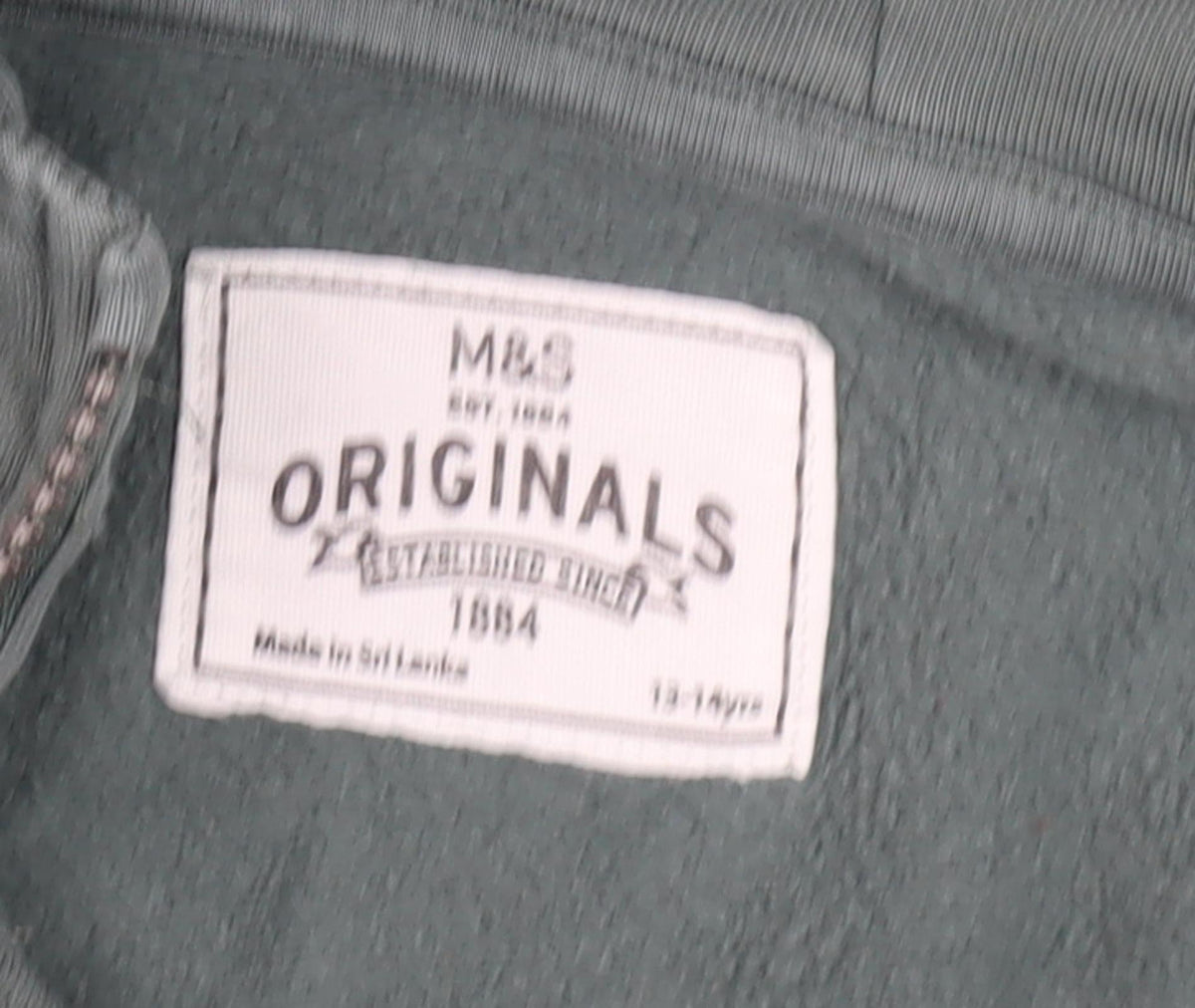 Close-up detail of Marks & Spencer boys’ green full zip hoodie 13-14 years