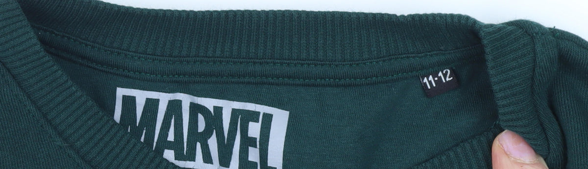 Close-up detail of Marvel boys’ green sweatshirt - comic print, 11-12 years
