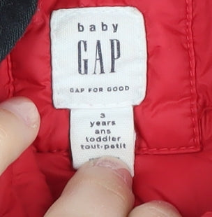 Brand and care label for Gap boys’ red puffer jacket, hooded, size 3, years