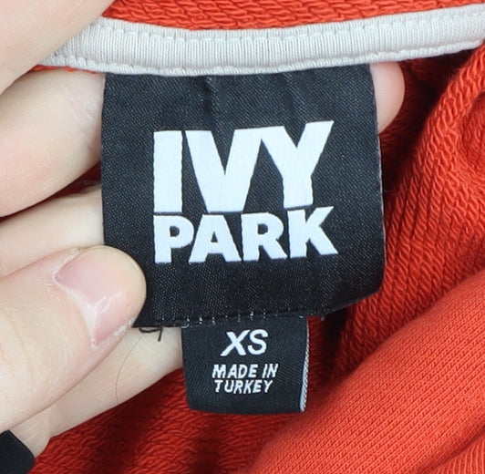 Brand and care label for Ivy Park Women's Orange Hoodie, XS, Logo Design