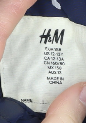 Additional view of H&M girls’ quilted blue jacket 12-13 years full zip mid-length