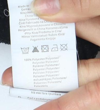 Brand and care label for Gelert boys’ black fleece jacket with full zip logo