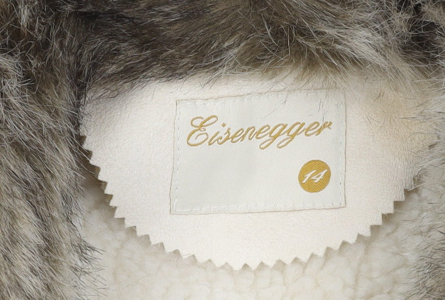 Brand and care label for Eisenegger girls’ ivory faux fur waistcoat, size 14