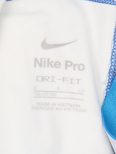 Brand and care label for Nike girls’ blue leggings - s yoga fitness activewear