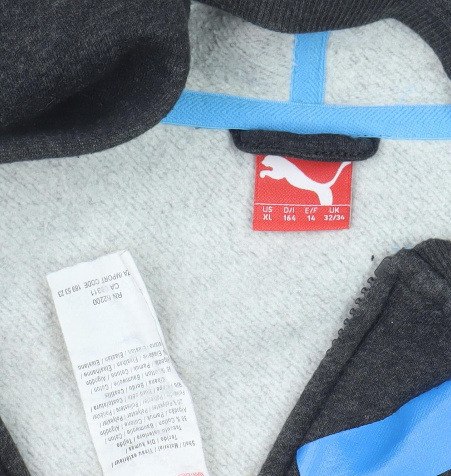 Close-up detail of Puma boys’ black full zip hoodie, size 14, graphic print