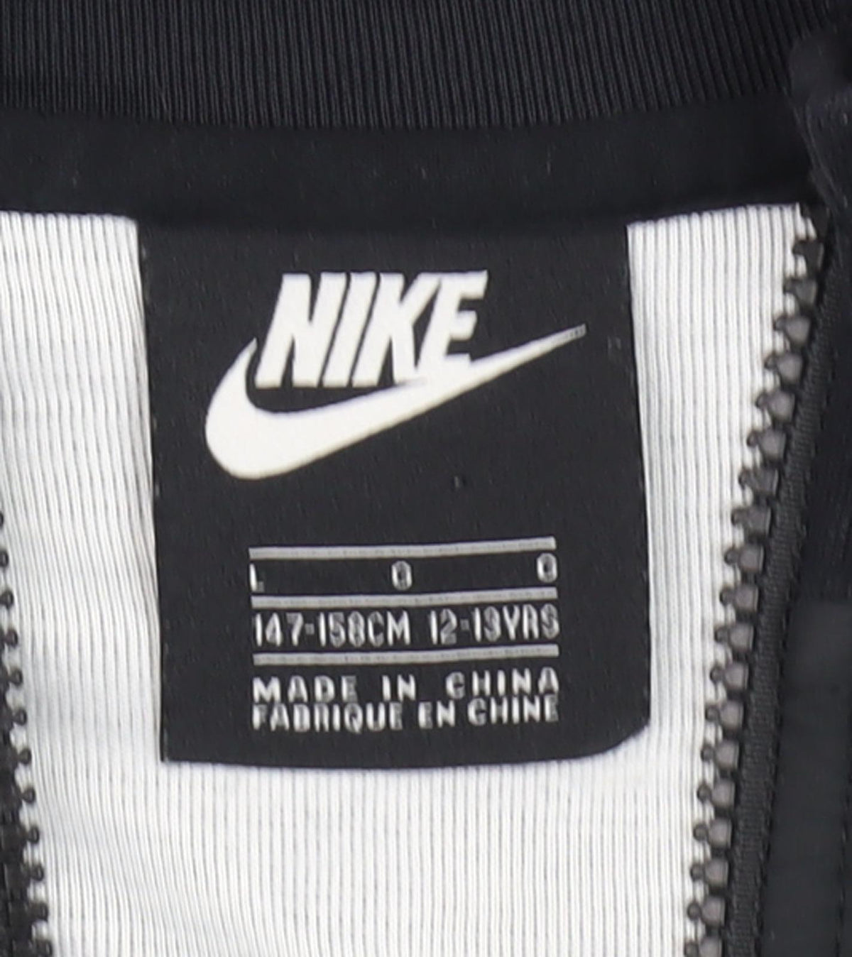 Close-up detail of Nike boys’ black full zip hoodie -, size 12-13, years
