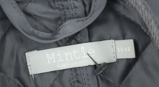 Brand and care label for Mintie girls’ quilted jacket, size 11, snap closure