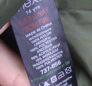 Brand and care label for Next boys’ green hooded jacket, size 14, years nylon acrylic wool