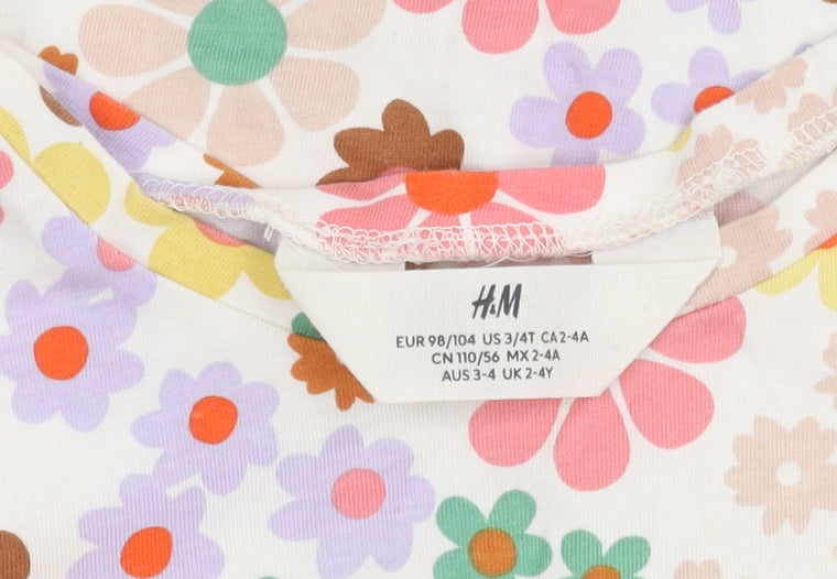 Brand and care label for H&M girls’ floral multicoloured cotton t-shirt 2-4 years