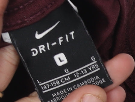 Close-up detail of Nike boys’ multicoloured l athletic shorts