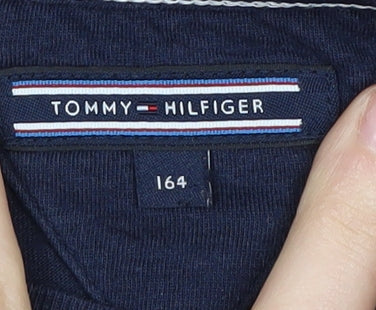 Close-up detail of Tommy Hilfiger girls’ blue t-shirt, size 164, graphic sequin logo