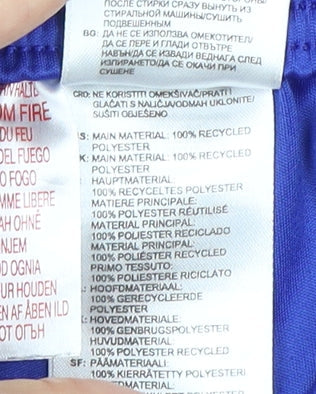 Brand and care label for Adidas boys’ blue football shorts 5-6 years