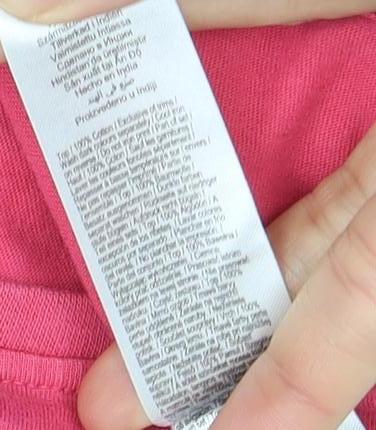 Brand and care label for JoJo Siwa girls’ pink graphic print long sleeve t-shirt