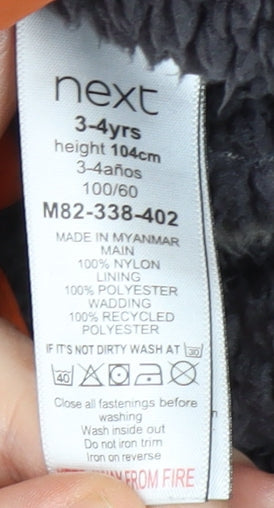 Close-up detail of Next boys’ orange puffer jacket, 4 years, winter essential, hooded