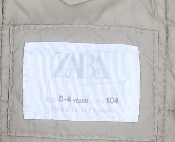 Brand and care label for Zara girls’ beige puffer jacket 3-4 years hooded snap closure