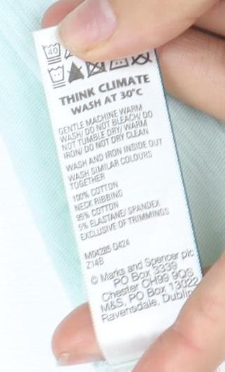 Brand and care label for Marks & Spencer girls’ mint green t-shirt, size 3, tropical print