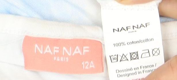 Close-up detail of NAF NAF girls’ blue white graphic t-shirt 12 years