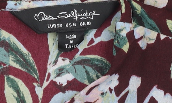 Brand and care label for Miss Selfridge Women's Floral Blouse, size 10