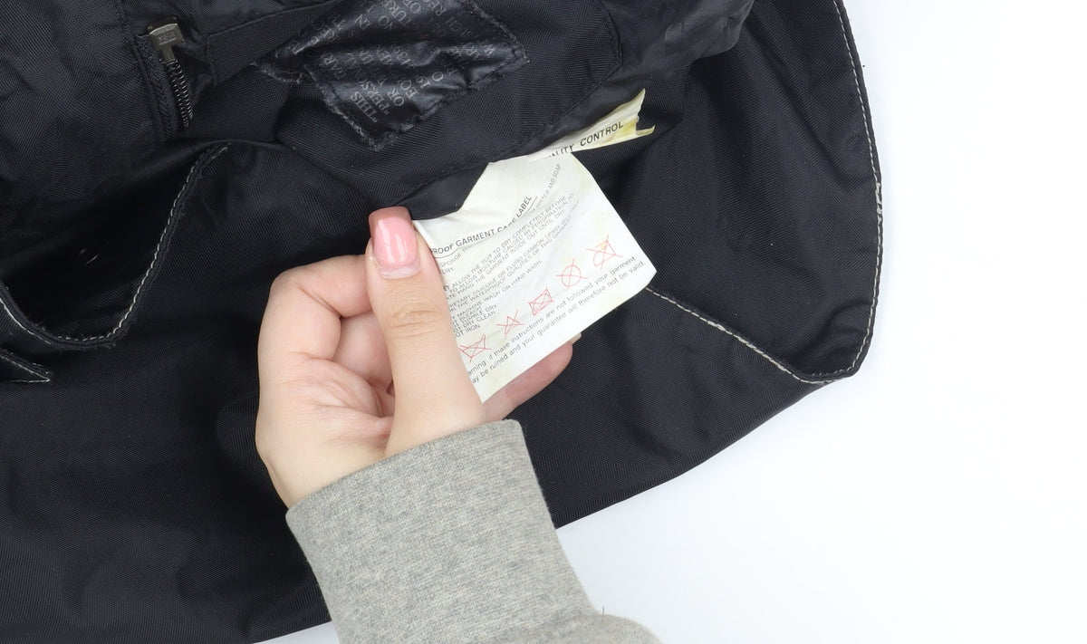 Brand and care label for Frank Thomas boys’ black l parka jacket, belted, winter