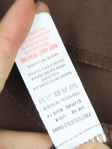 Close-up detail of PRETTYLITTLETHING Brown Long Sleeve Dress, size 12