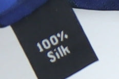Brand and care label for Thomas Nash Men's Blue Checked Silk Tie