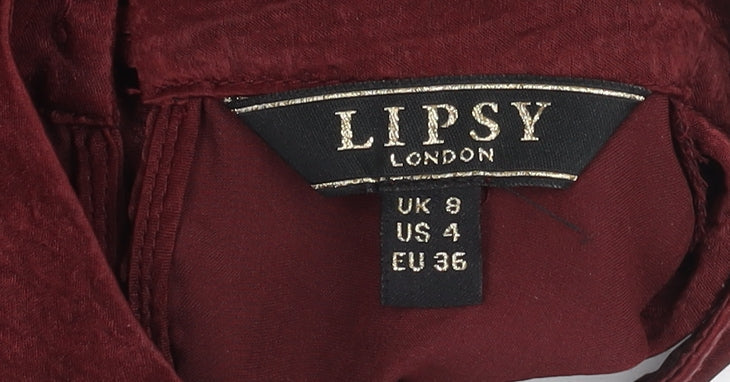 Brand and care label for Lipsy Red Ruffle Sleeve Wrap Blouse, size 8