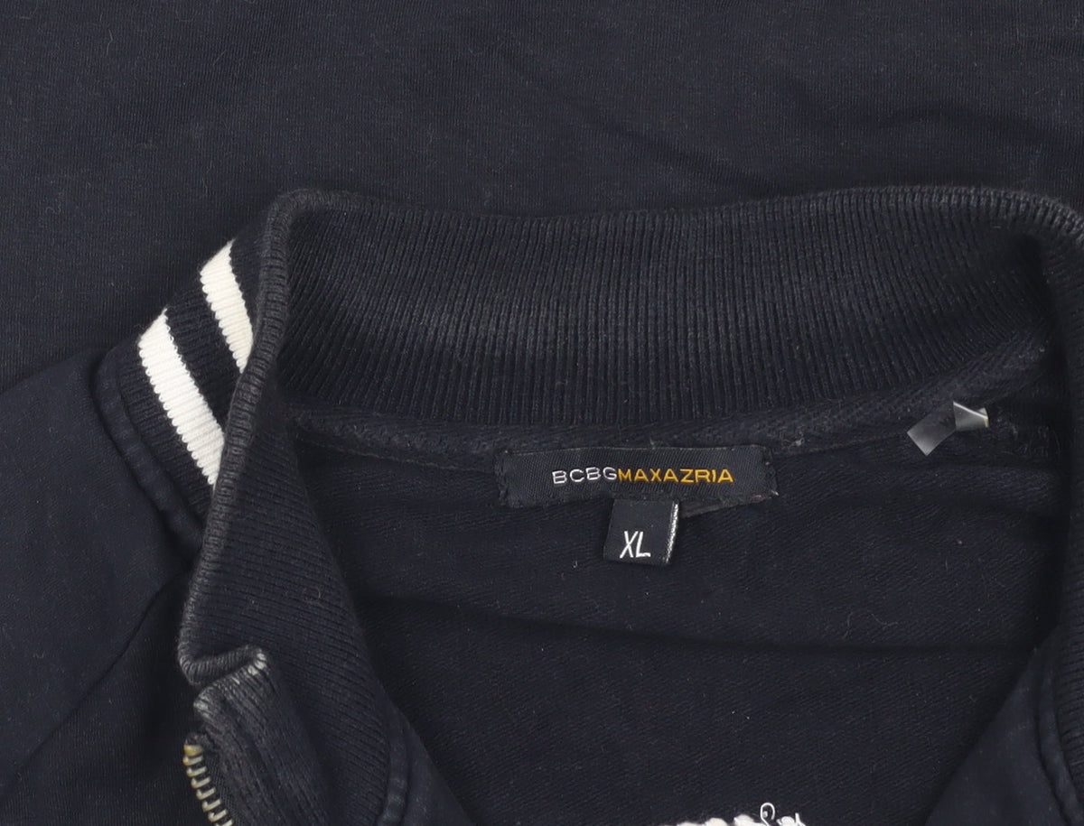 Close-up detail of BCBG Max Azria girls’ black track jacket, xl, short sleeve style