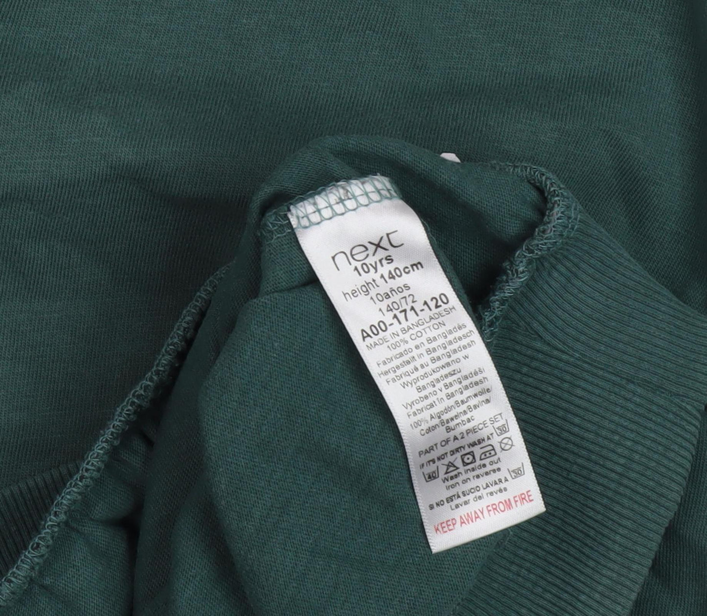 Close-up detail of Next girls’ green pullover sweatshirt, 10 years, graphic print