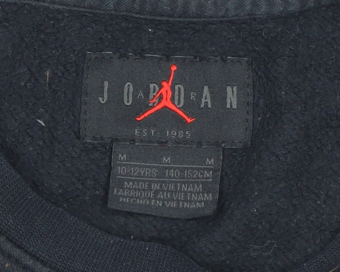 Close-up detail of Jordan boys’ black m pullover sweatshirt with logo