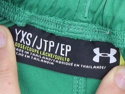 Close-up detail of Under Armour boys’ green xs athletic football shorts