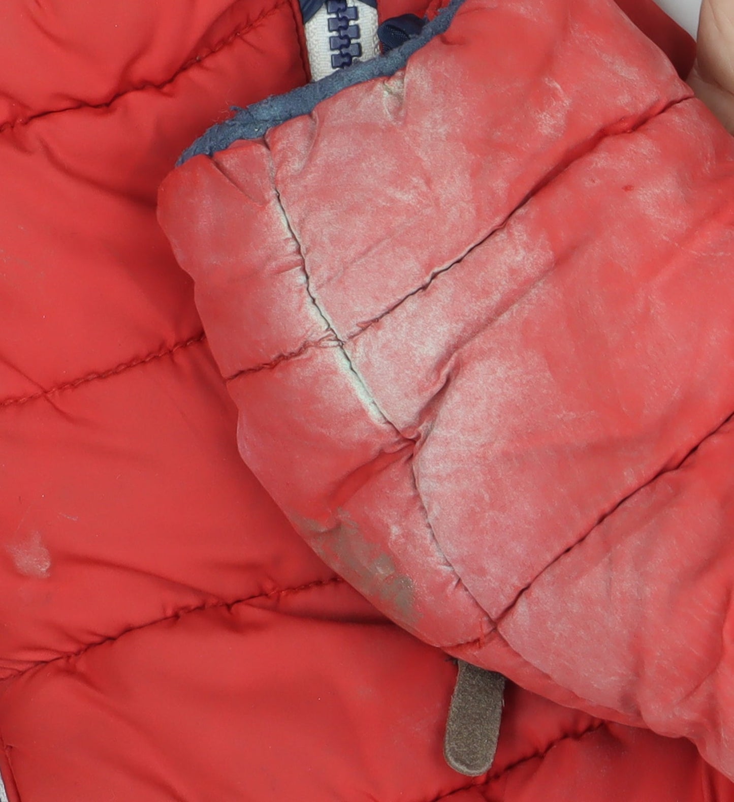 Brand and care label for Next boys’ red puffer jacket 5-6 years winter hooded
