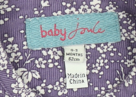 Brand and care label for Joules girls’ purple floral blouse 0-3 months