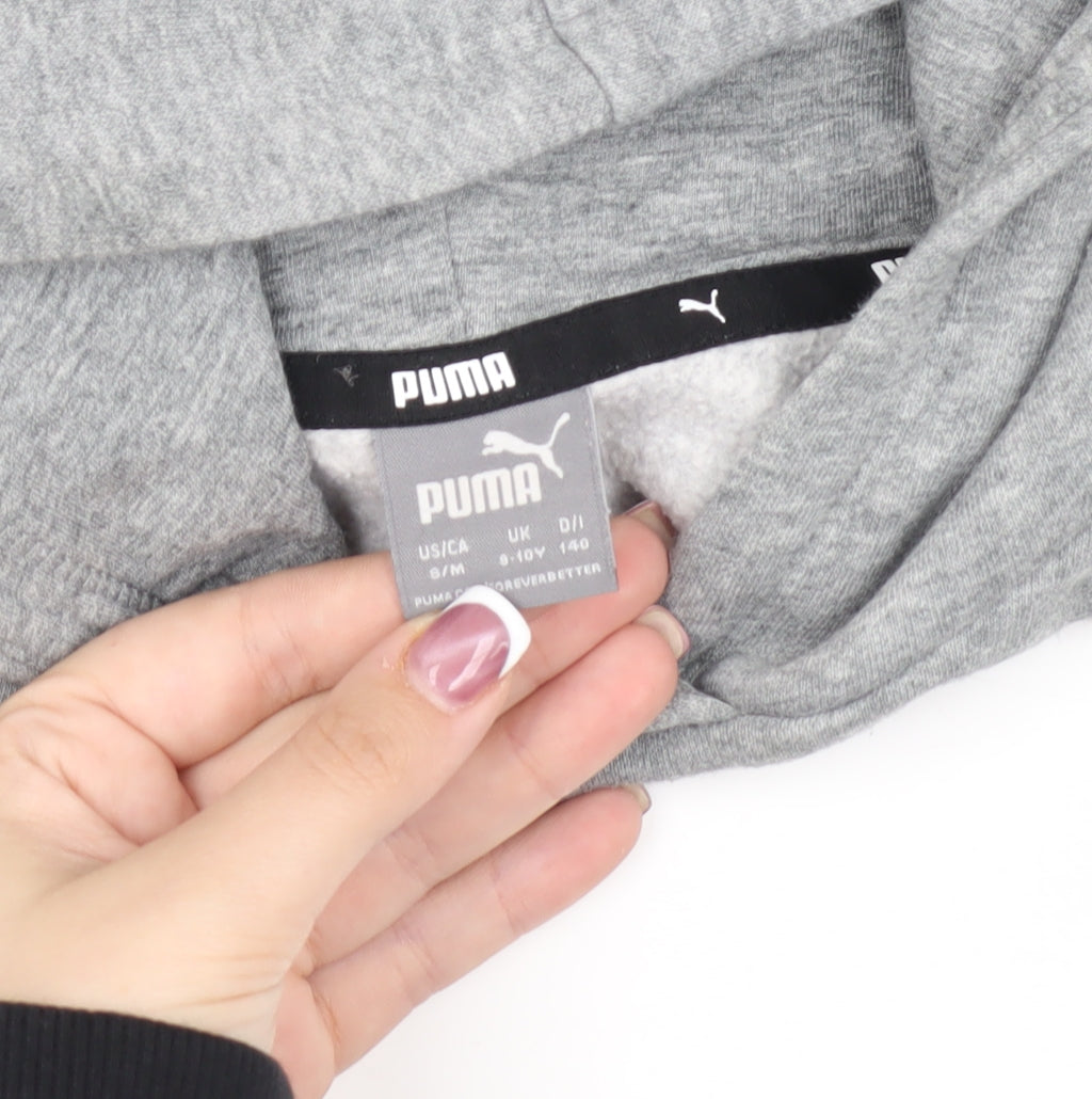 Close-up detail of Puma girls’ grey hoodie, 10 years, pullover style, logo