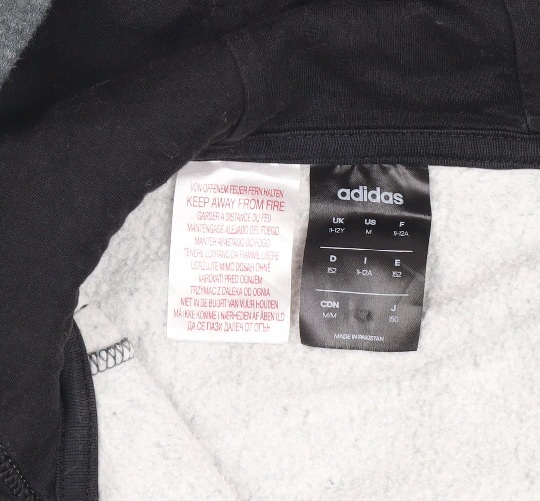 Close-up detail of Adidas boys’ black grey hooded track jacket 11-12y