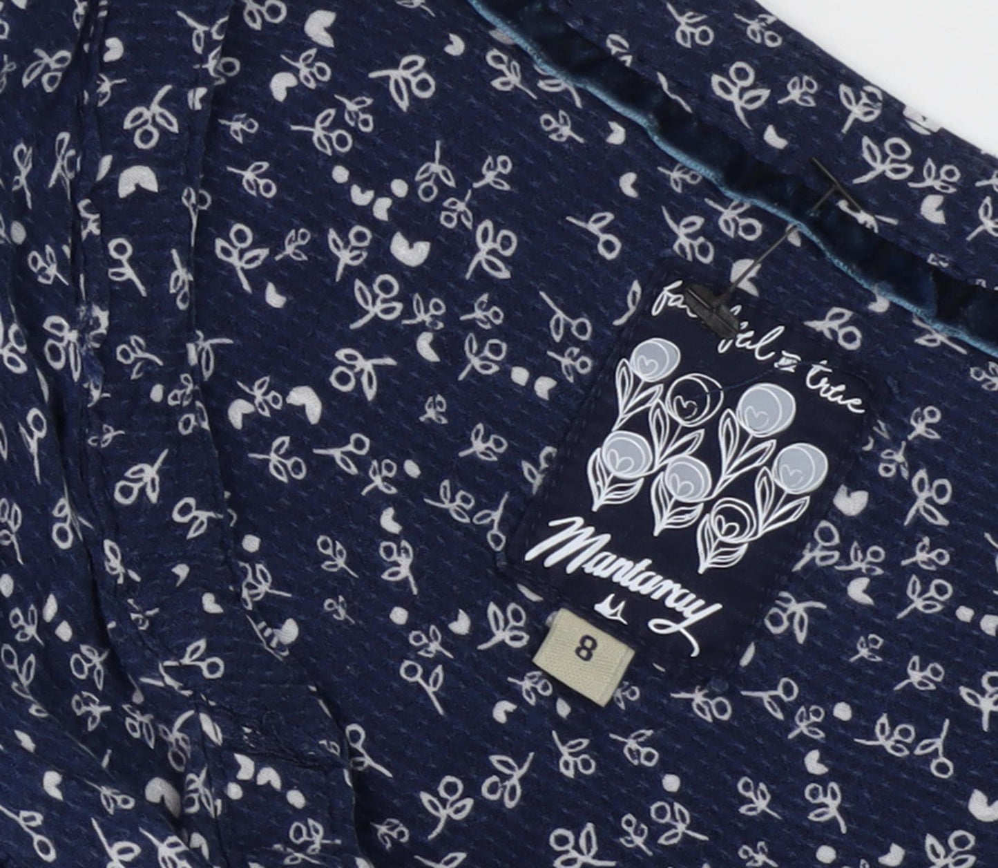 Close-up detail of Mantaray Women's Blue Floral Tunic Blouse, size 8