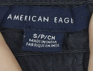Close-up detail of American Eagle girls’ black floral blouse s off shoulder