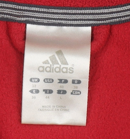 Brand and care label for Adidas Women's Red Full Zip Fleece Jacket, size 12